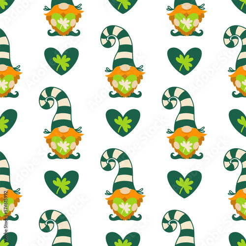 St. Patrick's Day seamless vector pattern. A gnome with a red beard, in a striped stocking cap holds a heart in his hands. Irish clover leaf, shamrock for good luck. Cartoon background for cards, web