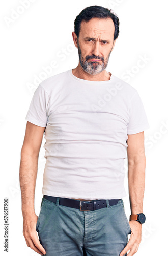 Middle age handsome man wearing casual t-shirt depressed and worry for distress, crying angry and afraid. sad expression. © Krakenimages.com