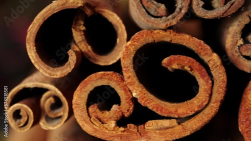 Unique close up of cinnamon barks. Dried harvested sticks. Dolly shot photo