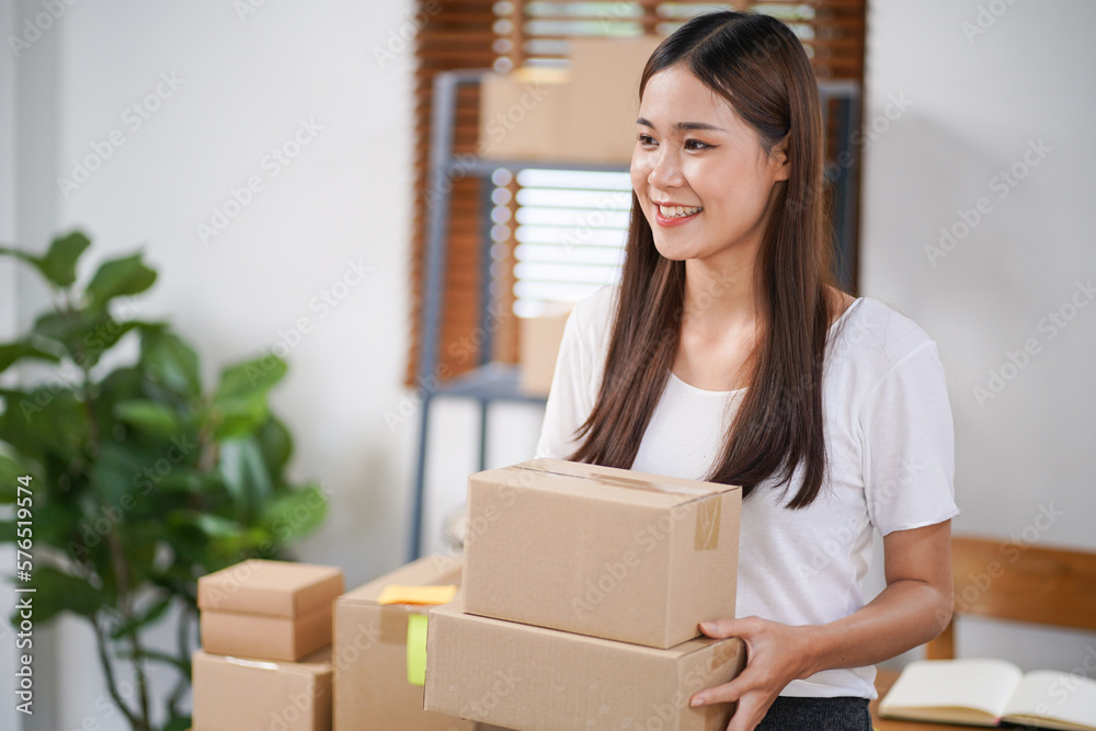 Business From Home Asian woman preparing package delivery box Shipping for shopping online. young start up small business owner at home online order