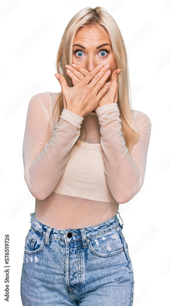Young blonde woman wearing casual clothes shocked covering mouth with hands for mistake. secret concept. Young blonde woman wearing casual clothes shocked covering mouth with hands for mistake. secret concept.