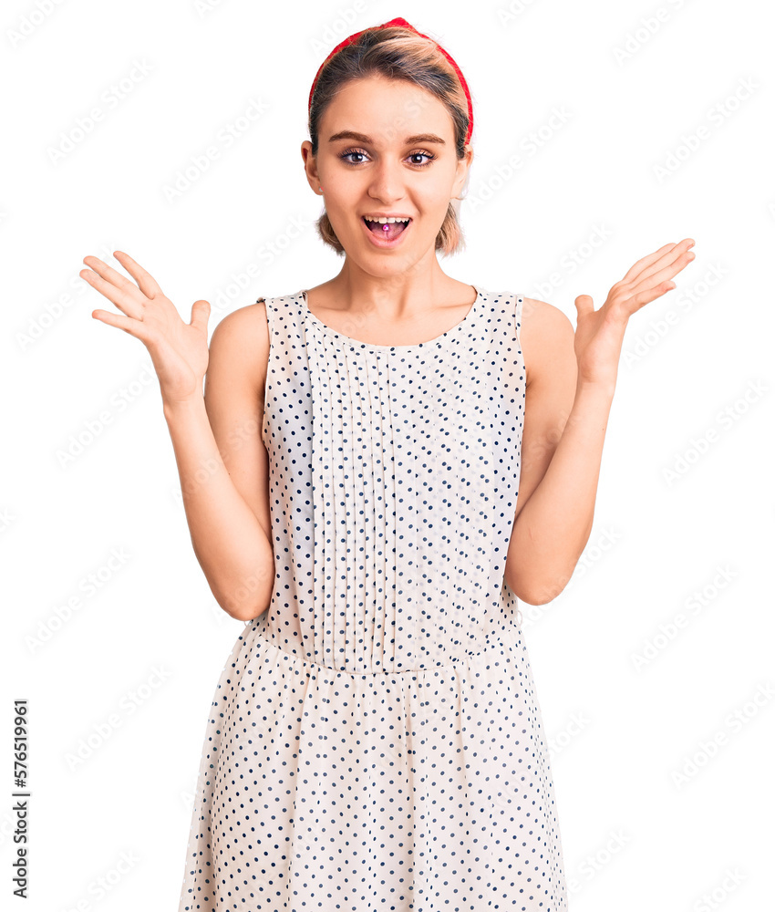 Young beautiful blonde woman wearing casual clothes celebrating victory with happy smile and winner expression with raised hands