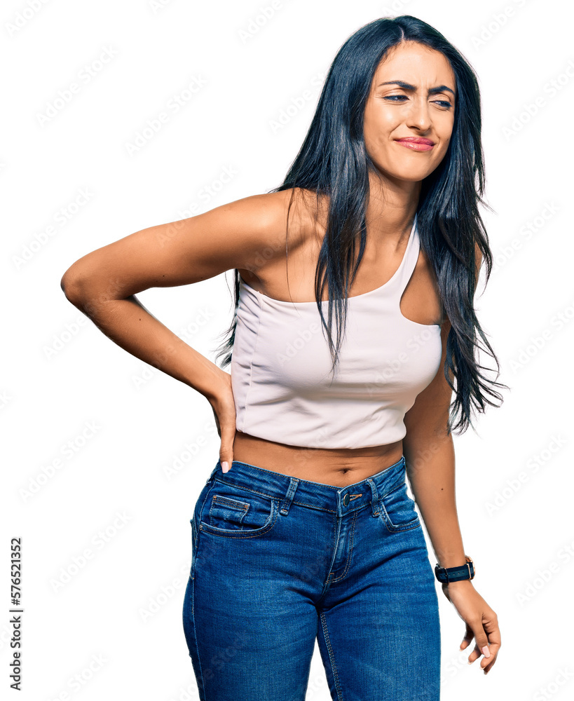 Fototapeta premium Beautiful hispanic woman wearing casual clothes suffering of backache, touching back with hand, muscular pain