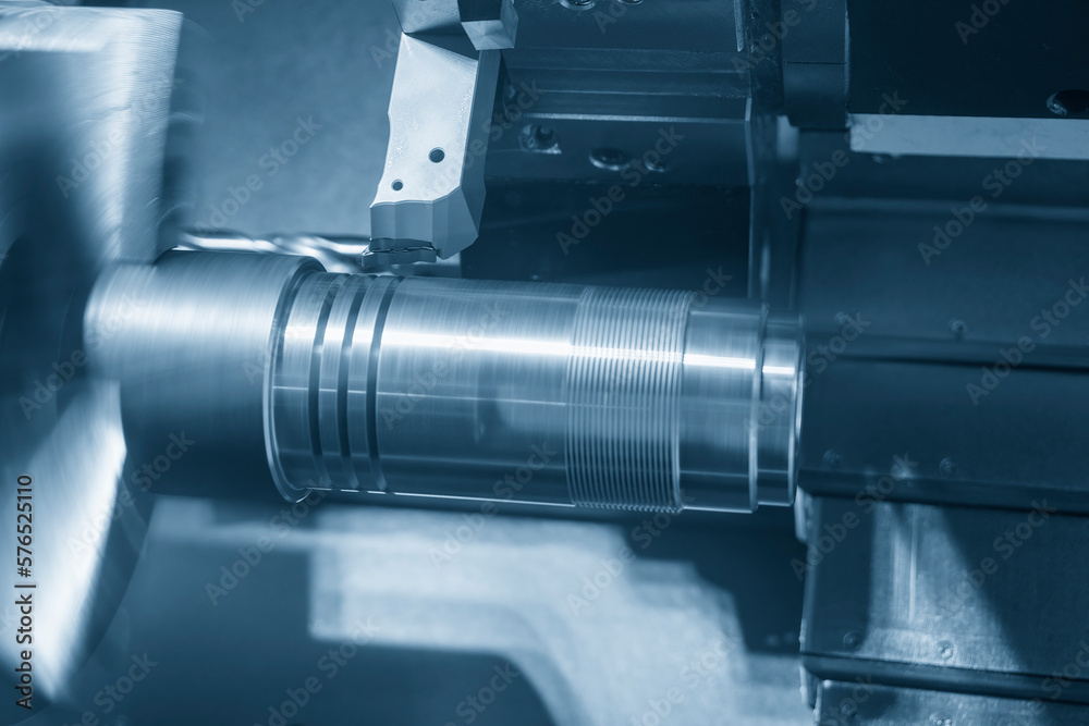 The CNC lathe machine forming cutting the metal shaft parts. The CNC lathe machine forming cutting the metal shaft parts.