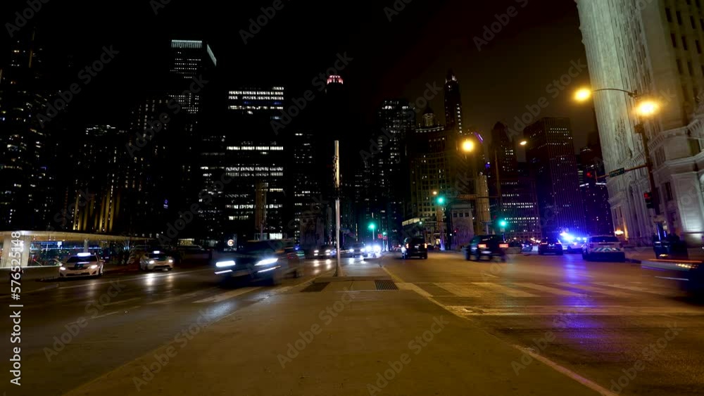 Night time lapse of Chicago streets downtown. the cars in traffic left trails of lights as they speed by on the expressway in this urban expressway Night time lapse of Chicago streets downtown. the cars in traffic left trails of lights as they speed by on the expressway in this urban expressway