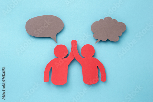 Red people with gray speech bubble made of paper cut on blue background. paper art minimal concept.