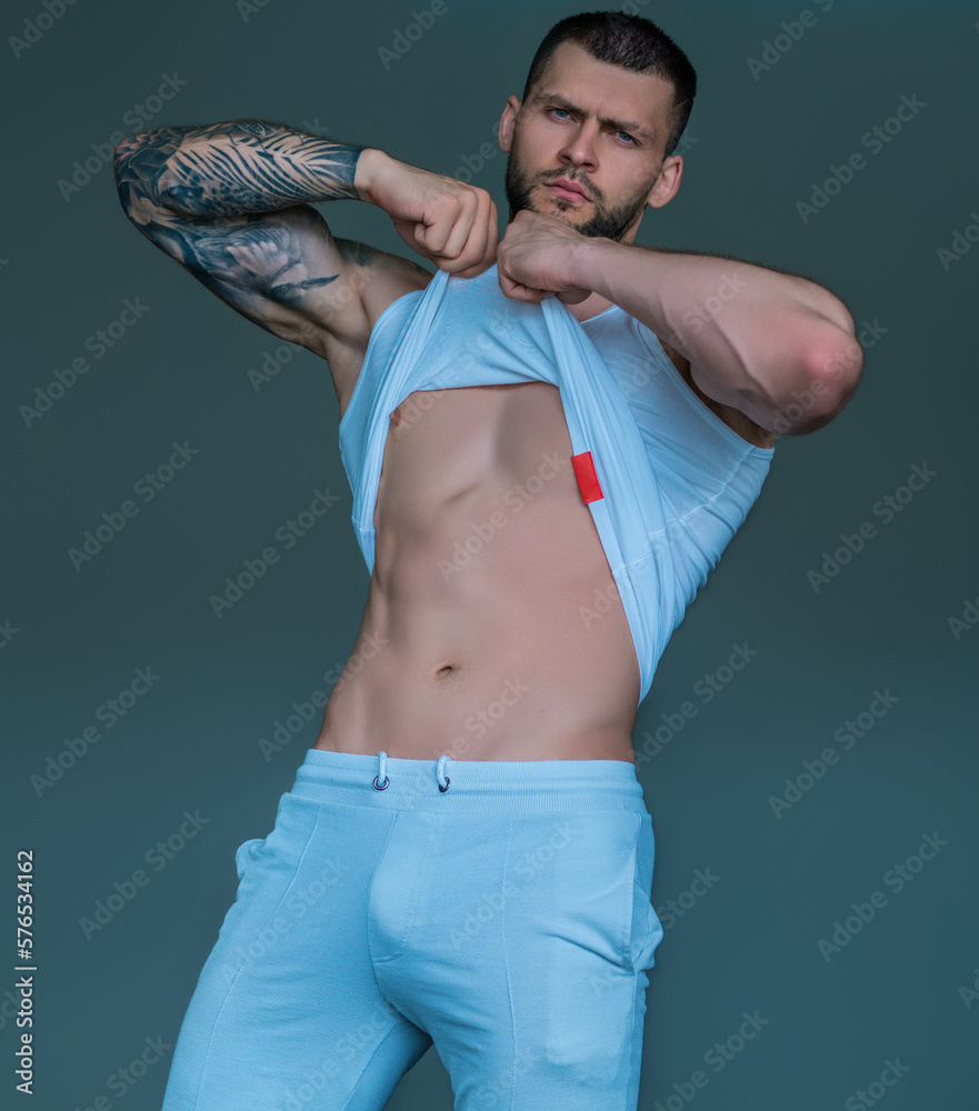Seductive gay. Muscular body of man. Strong brutal guy. Sexy male naked  torso. Nude muscular body man with tattoo showing fit muscular strong body.  Muscular gay. Photos | Adobe Stock