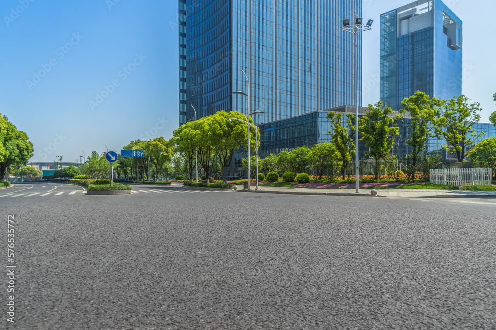 empty asphalt road front of modern building