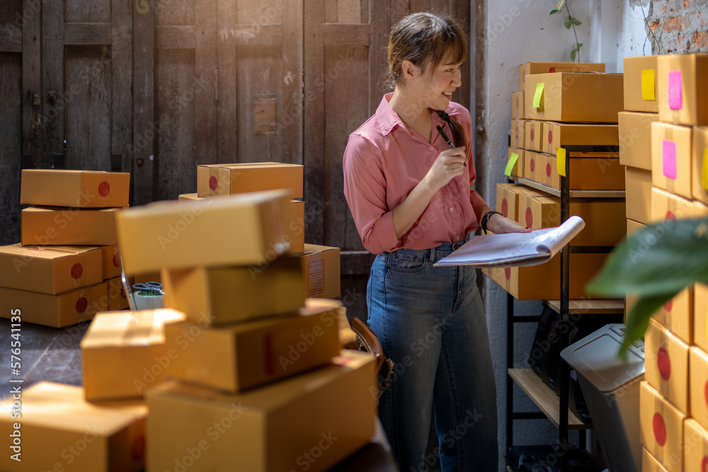 Asian teenager owner business woman work at home for online shopping and sale.. Asian teenager owner business woman work at home for online shopping and sale..