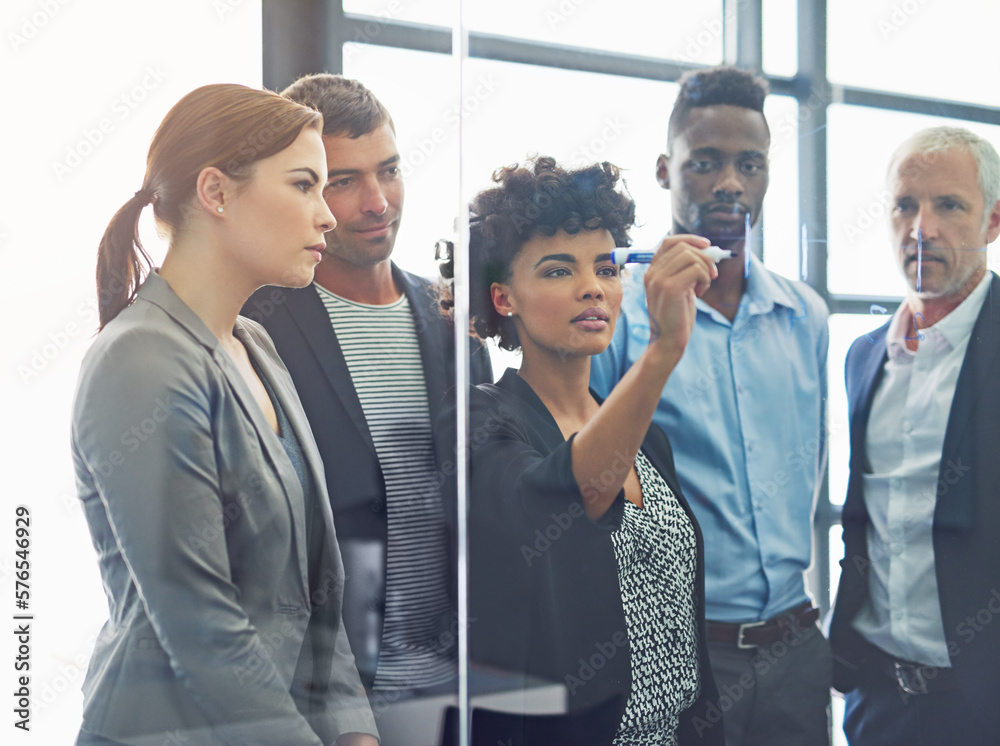 Obraz premium Prioritizing tasks for their team project. Shot of a group of colleagues having a brainstorming session at work.