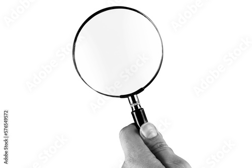 Human hand holding classic magnifying glass
