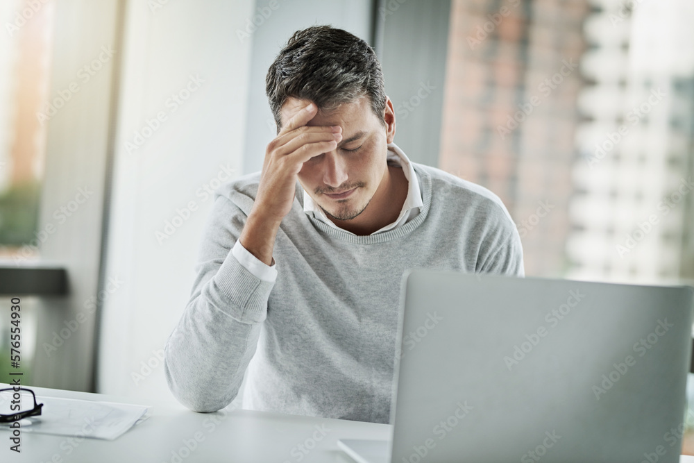 How did I manage to mess this up.... Shot of a young businessman looking stressed out while working in an office. How did I manage to mess this up.... Shot of a young businessman looking stressed out while working in an office.