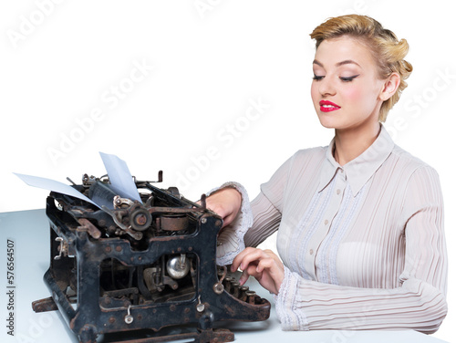 Retro woman working in office with vintage typewriter and phone, dressed in pin-up style photo