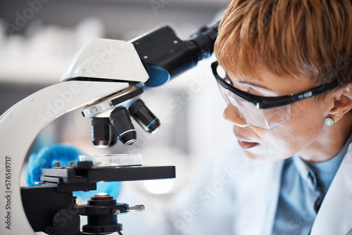 Medical science, woman and glasses at microscope in a laboratory for research, analytics and to study. Scientist person with Petri dish in lab for dna particle, future and biotechnology innovation