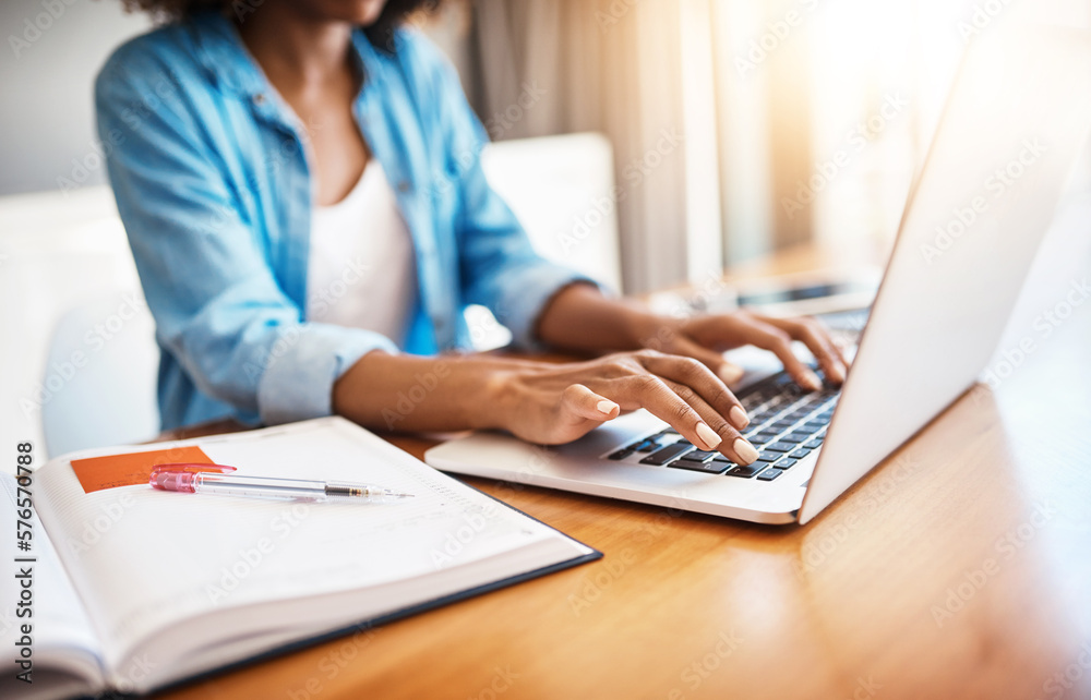 She definitely knows her way around the web. Shot of an unrecognizable young woman working on her laptop at home.