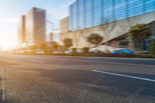 city empty traffic road with cityscape in background