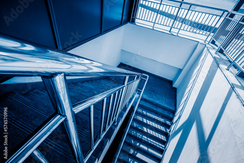 stairs in office building, blue toned image,