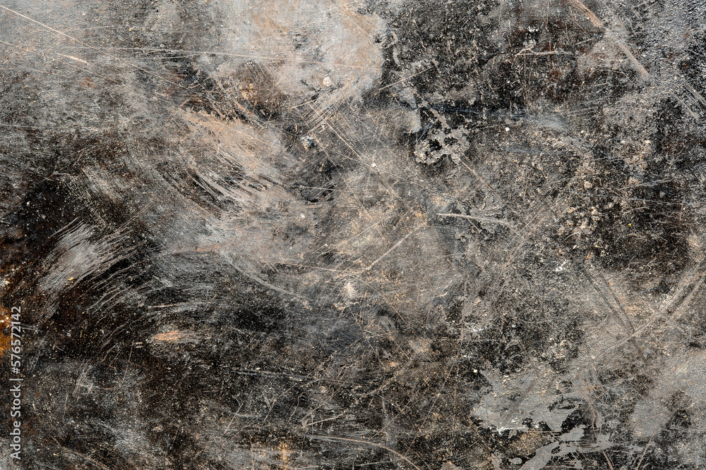 Grunge old black metal background or texture with scratches and cracks, closeup, top view Grunge old black metal background or texture with scratches and cracks, closeup, top view