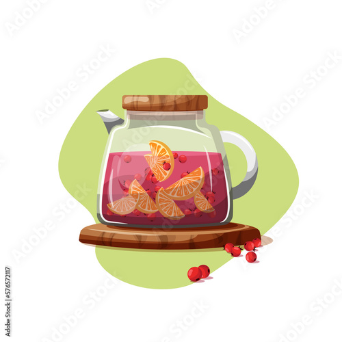 Glass teapot with berry drink. Compote in a jug.