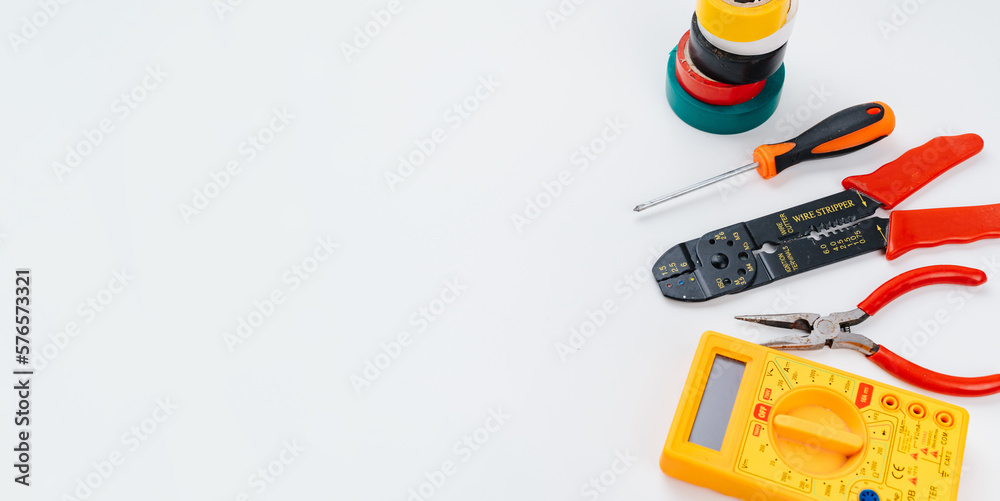 Stripper, Pliers, Multimeter, insulating tape and Screwdriver on a white. Stripper, Pliers, Multimeter, insulating tape and Screwdriver on a white.