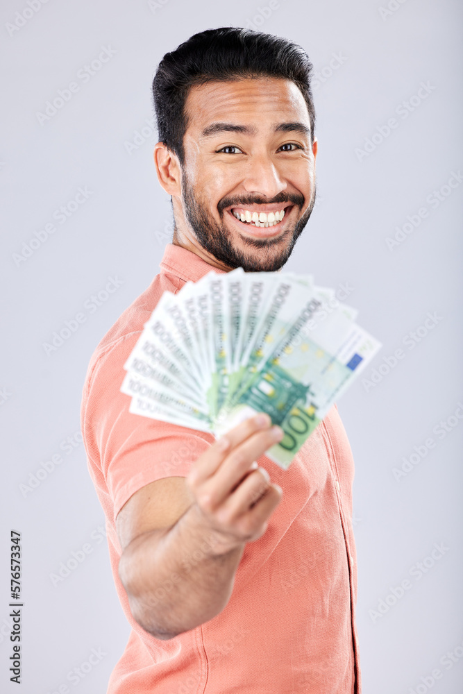 Showing, rich and portrait of Asian man with money isolated on a grey studio background. Finance, wealth and excited person holding cash from investment, lottery and winning the jackpot on a backdrop Showing, rich and portrait of Asian man with money isolated on a grey studio background. Finance, wealth and excited person holding cash from investment, lottery and winning the jackpot on a backdrop