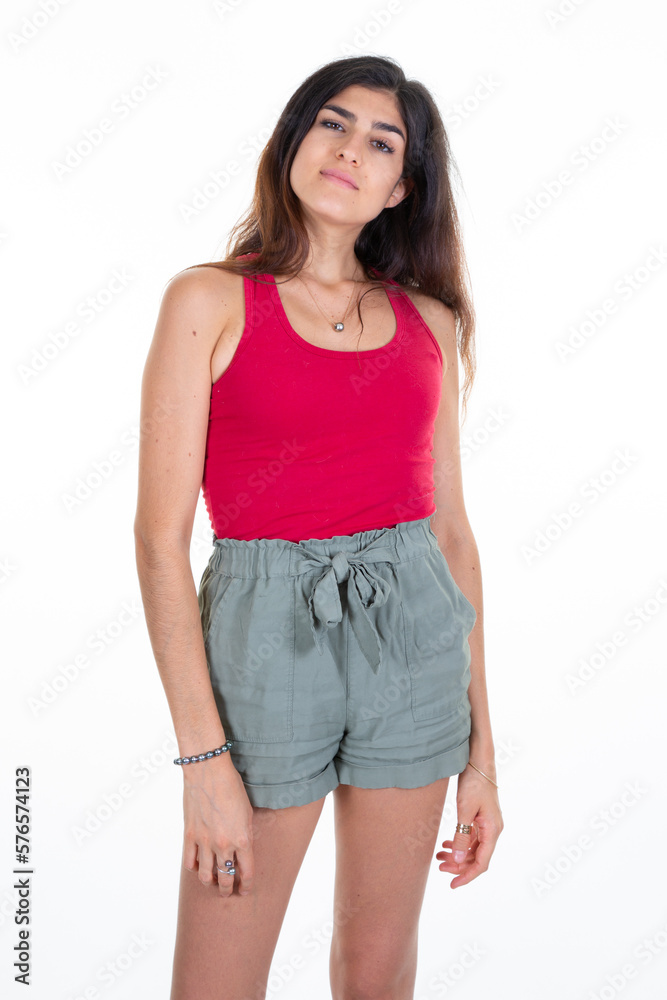 pretty young woman wearing red shirt and short slim girl on white background pretty young woman wearing red shirt and short slim girl on white background