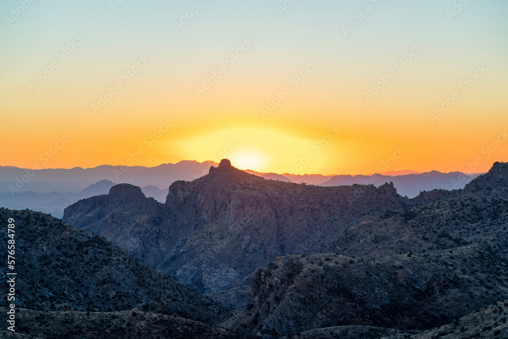 Fototapeta premium Natural sunset hills and mountains in the deep wilderness and desert of tuscon arizona in orange yellow sunset twilight