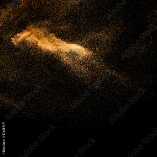 Sand explosion isolated on black background. Freeze motion of sandy dust splash.Sand texture concept.