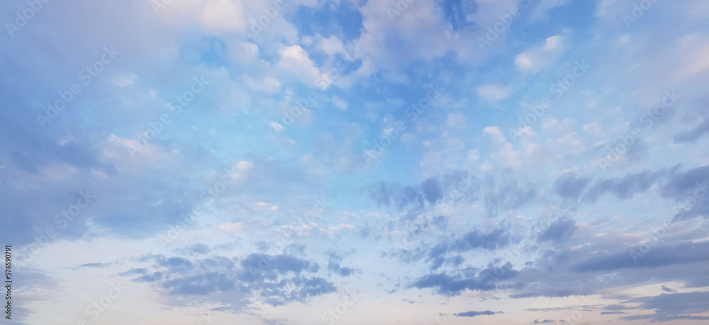 Clear blue sky background, clouds on skyline
