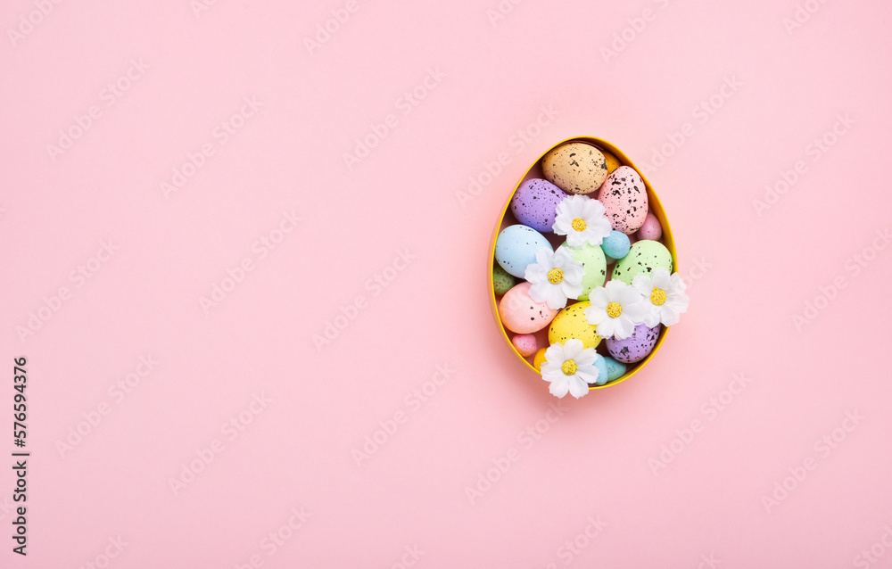 Easter Eggs with Sweets and Spring Flowers on Pink Background Easter Eggs with Sweets and Spring Flowers on Pink Background