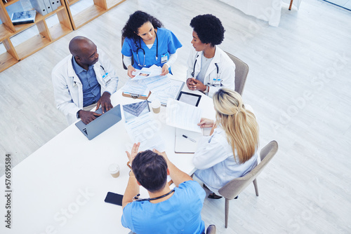 Fototapeta Above, healthcare and meeting by doctors on laptop for research, planning and innovation at hospital