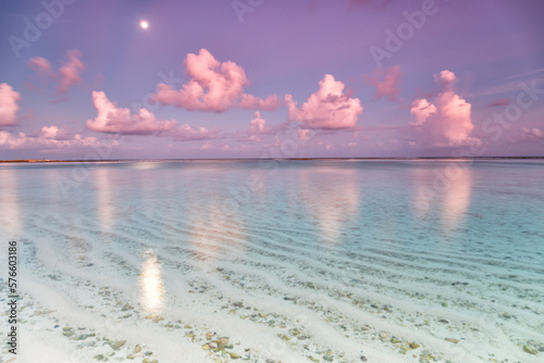 Sunrise on the beach paradise island Gulhi. Indian Ocean, Maldives photo