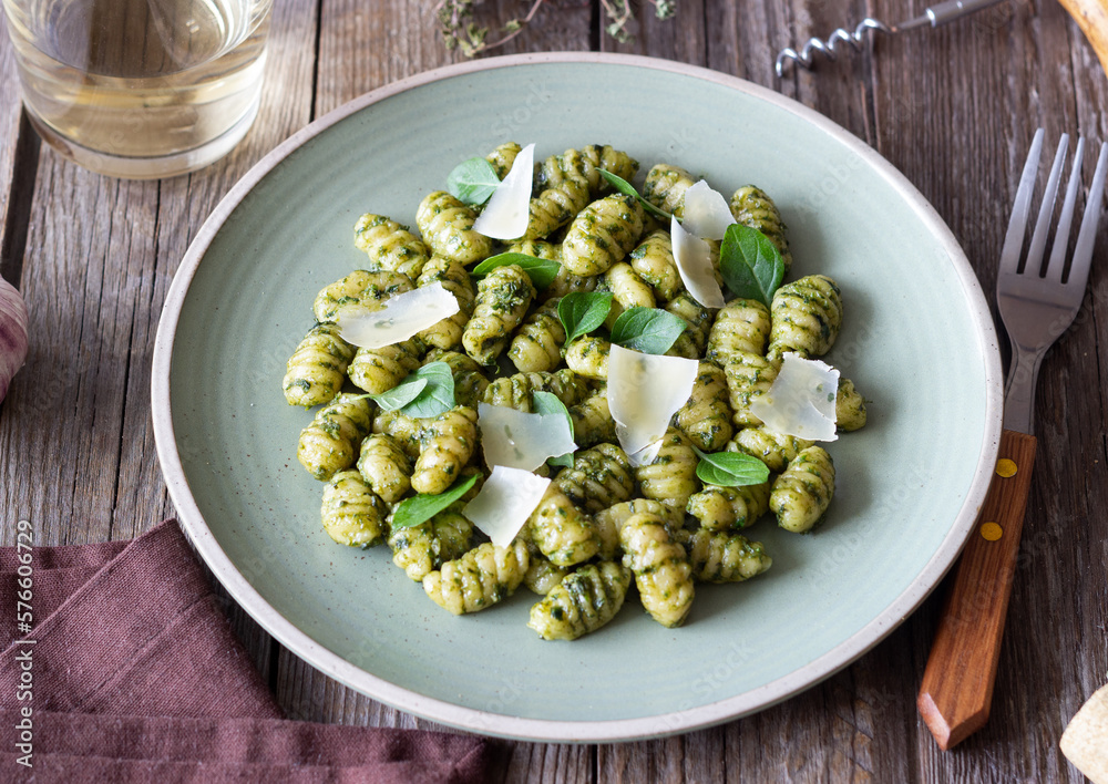 Gnocchi with pesto sauce, basil and Parmesan cheese. Healthy food. Vegetarian food. Diet. Gnocchi with pesto sauce, basil and Parmesan cheese. Healthy food. Vegetarian food. Diet.