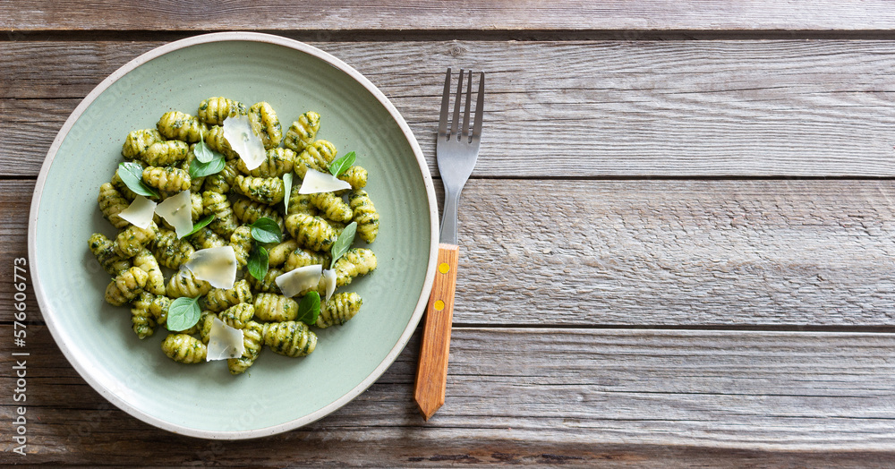 Gnocchi with pesto sauce, basil and Parmesan cheese. Healthy food. Vegetarian food. Diet. Gnocchi with pesto sauce, basil and Parmesan cheese. Healthy food. Vegetarian food. Diet.