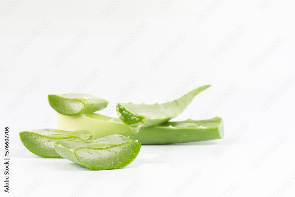 Fresh aloe vera leaves and slices isolate against white background for health and beauty products. Fresh aloe vera leaves and slices isolate against white background for health and beauty products.