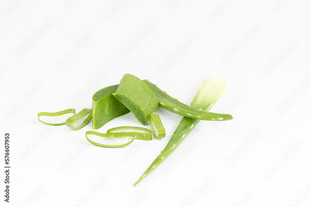Fresh aloe vera leaves and slices isolate against white background for health and beauty products. Fresh aloe vera leaves and slices isolate against white background for health and beauty products.
