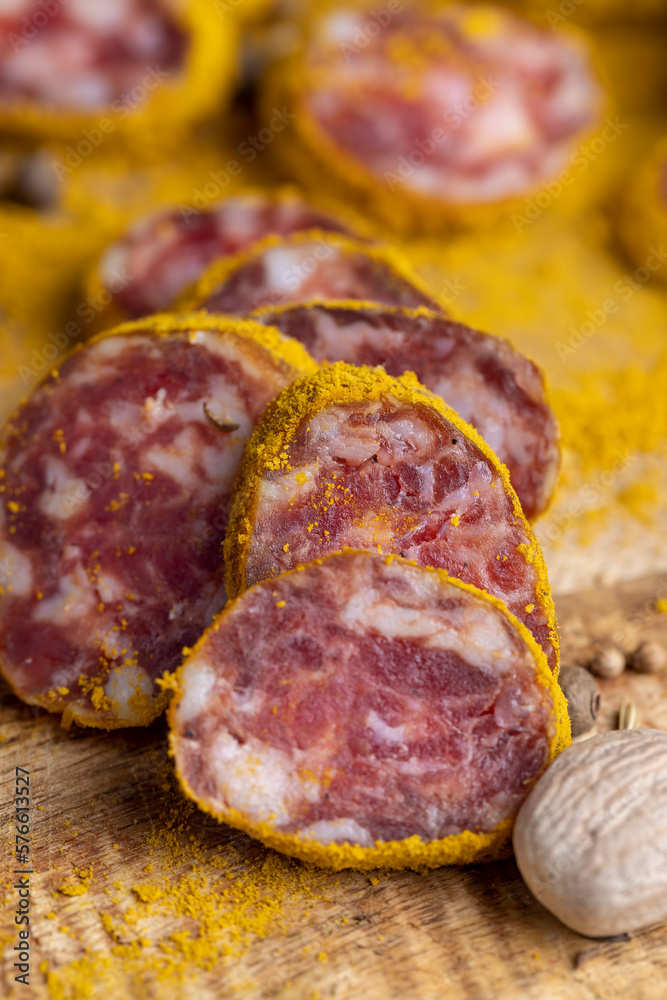 Sliced pork salami with spices and lots of turmeric Sliced pork salami with spices and lots of turmeric