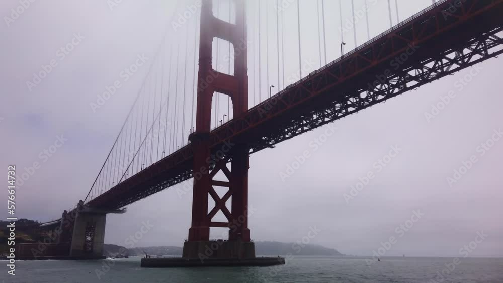 Gimbal close-up shot from a moving boat as it passes underneath the Golden Gate Bridge on a foggy day in San Francisco, California. 4K Gimbal close-up shot from a moving boat as it passes underneath the Golden Gate Bridge on a foggy day in San Francisco, California. 4K