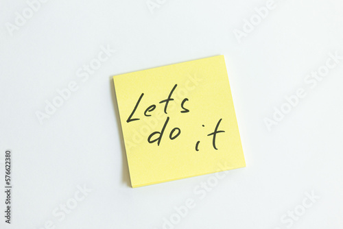 lets do it inscription on a piece of paper
