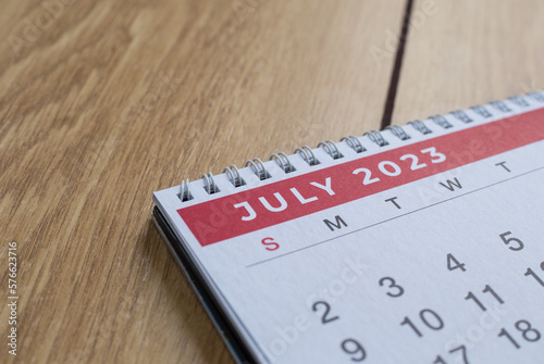 Closeup shot of a 2023 calendar, "July page". Selective focus shot of a calendar, focused on "July, 2023".