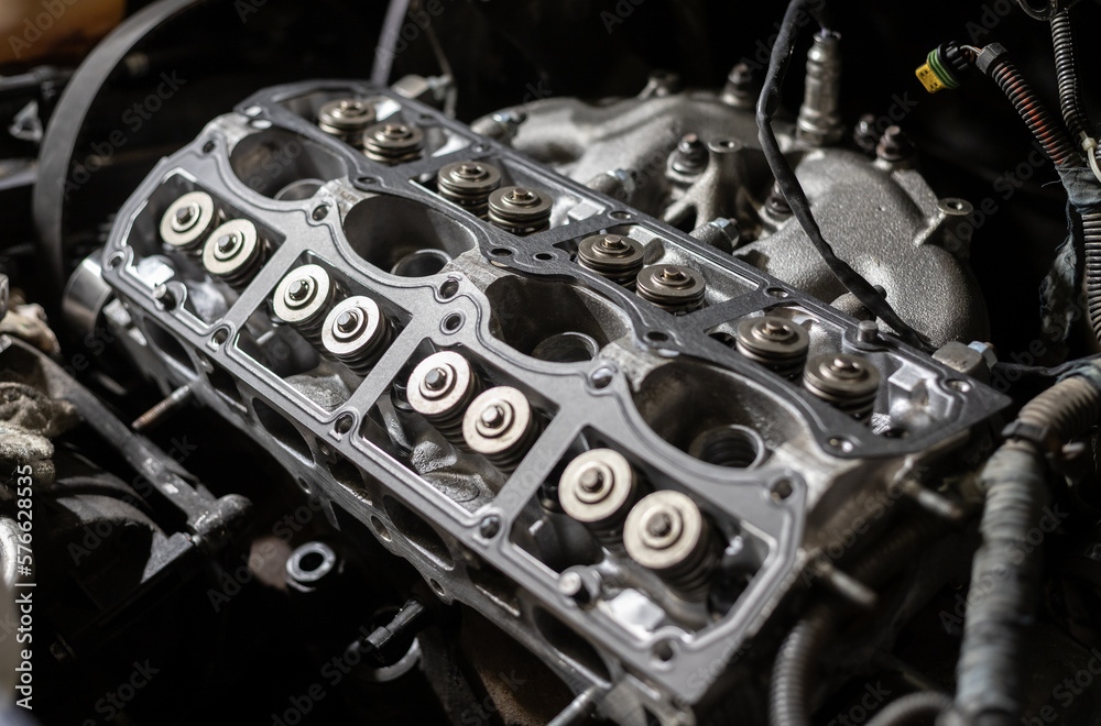Cylinder head of a car engine. Sixteen valves. Repairing car. Auto service. Cylinder head of a car engine. Sixteen valves. Repairing car. Auto service.