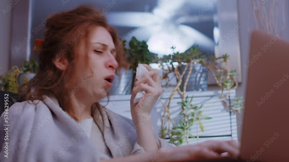 (Camera: ARRI ALEXA, real time) A caucasian woman is sick working from home on laptop, coughing, miserable. For more variations of this clip, check out this seller's other videos. (Camera: ARRI ALEXA, real time) A caucasian woman is sick working from home on laptop, coughing, miserable. For more variations of this clip, check out this seller's other videos.