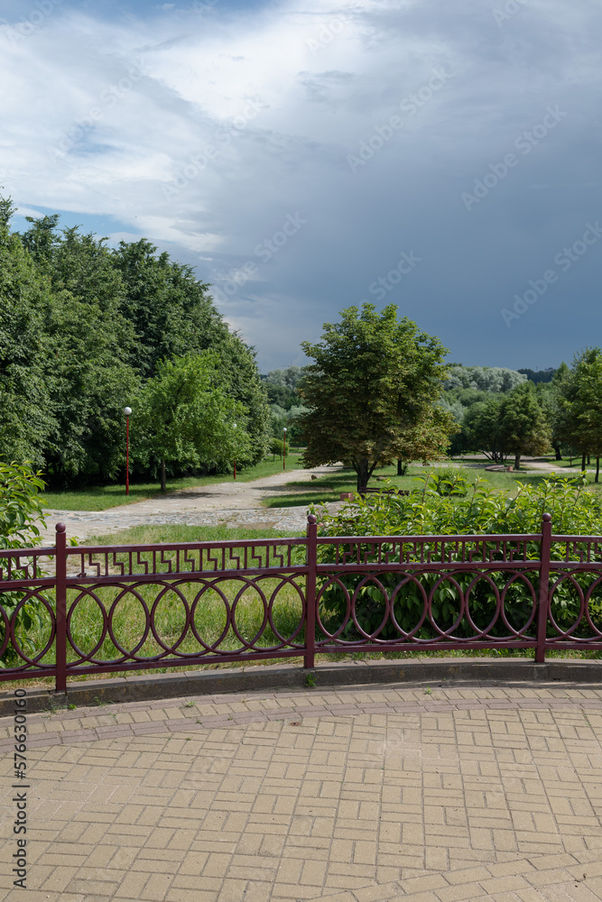 Wooden fence and railing in a rustic style on a summer day Wooden fence and railing in a rustic style on a summer day