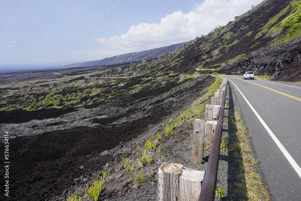 Asphalt road going throw lava field in Volcanoes  National park in Big Island in Hawaii