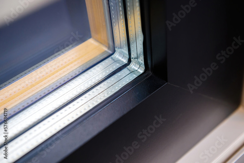 Close-up macro view of window frame made from PVC wooden profiles - double glazing