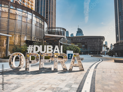 Dubai Opera house Sign in Downtown Dubai, surrounded by skyscrapers and Burj Khalifa, in UAE, United Arab Emirates photo