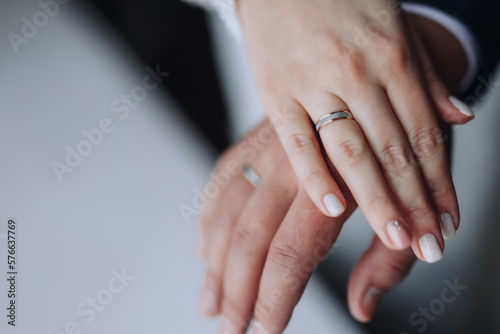 Male and female hand on a green background