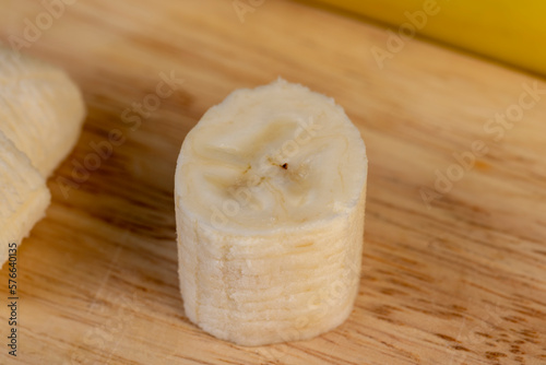 a ripe sweet banana cut into pieces lies on the table