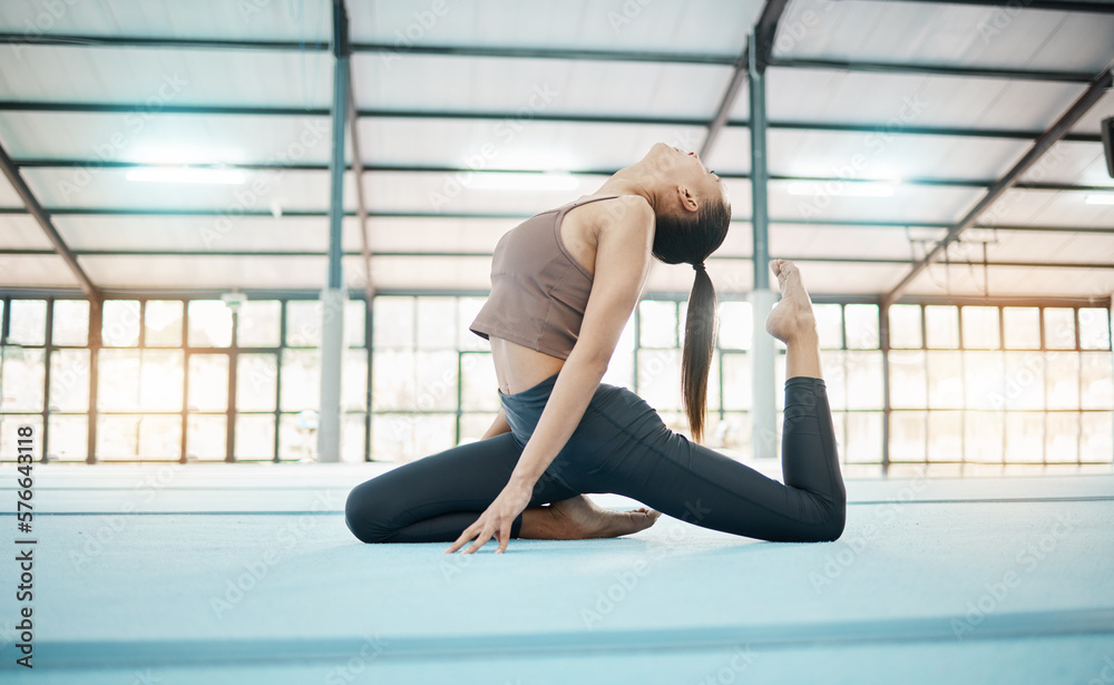 Fototapeta premium Fitness, gymnastics and balance with a black woman training in a gym for an olympics competition. Exercise, workout and flexibility with a female gymnast in a studio to practice for her performance