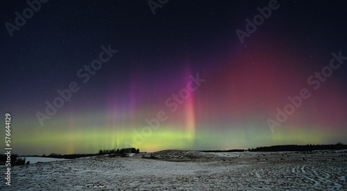 Northern lights - Aurora borealis dancing in the night sky.